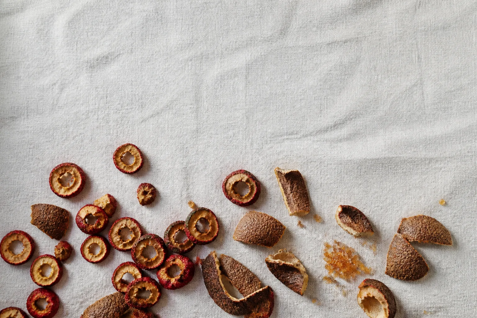 Dried hawthorn slices, chen pi peel, and brown sugar for anti-bloating tea
