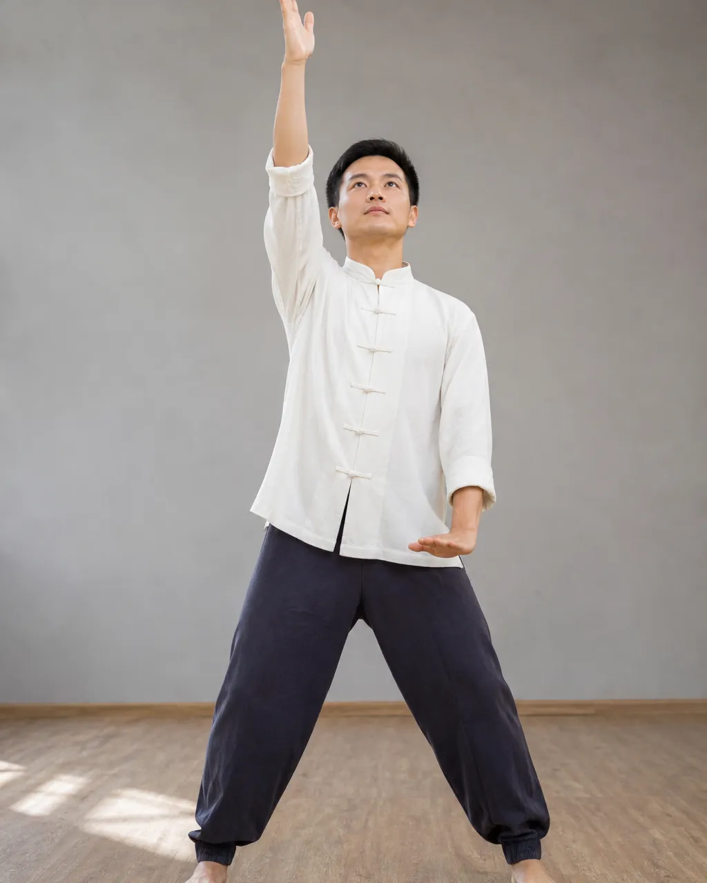 Person thrusting one palm up and one palm down in Separate Heaven and Earth