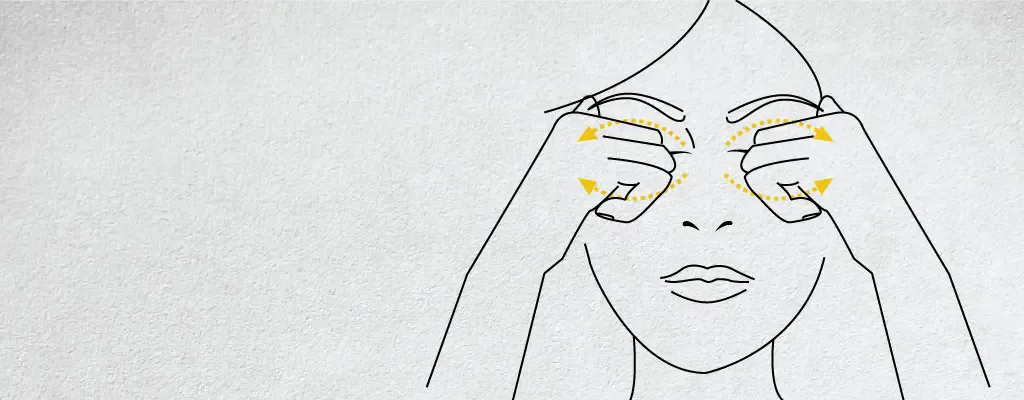 Line diagram of upper and lower orbital massage around closed eyes