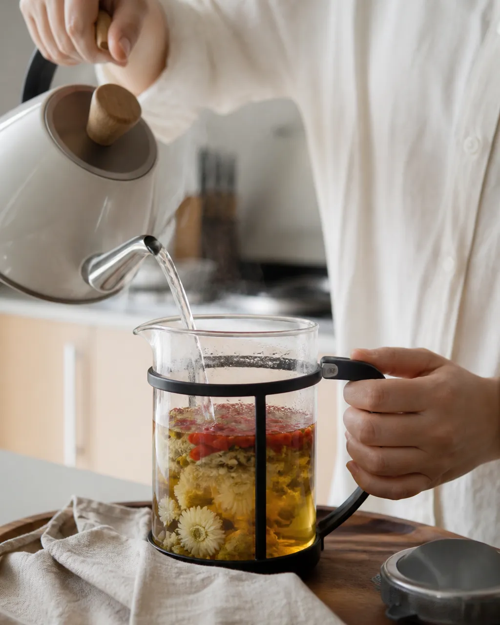 Chamomile, chrysanthemum, and wolfberries steeping in a teapot
