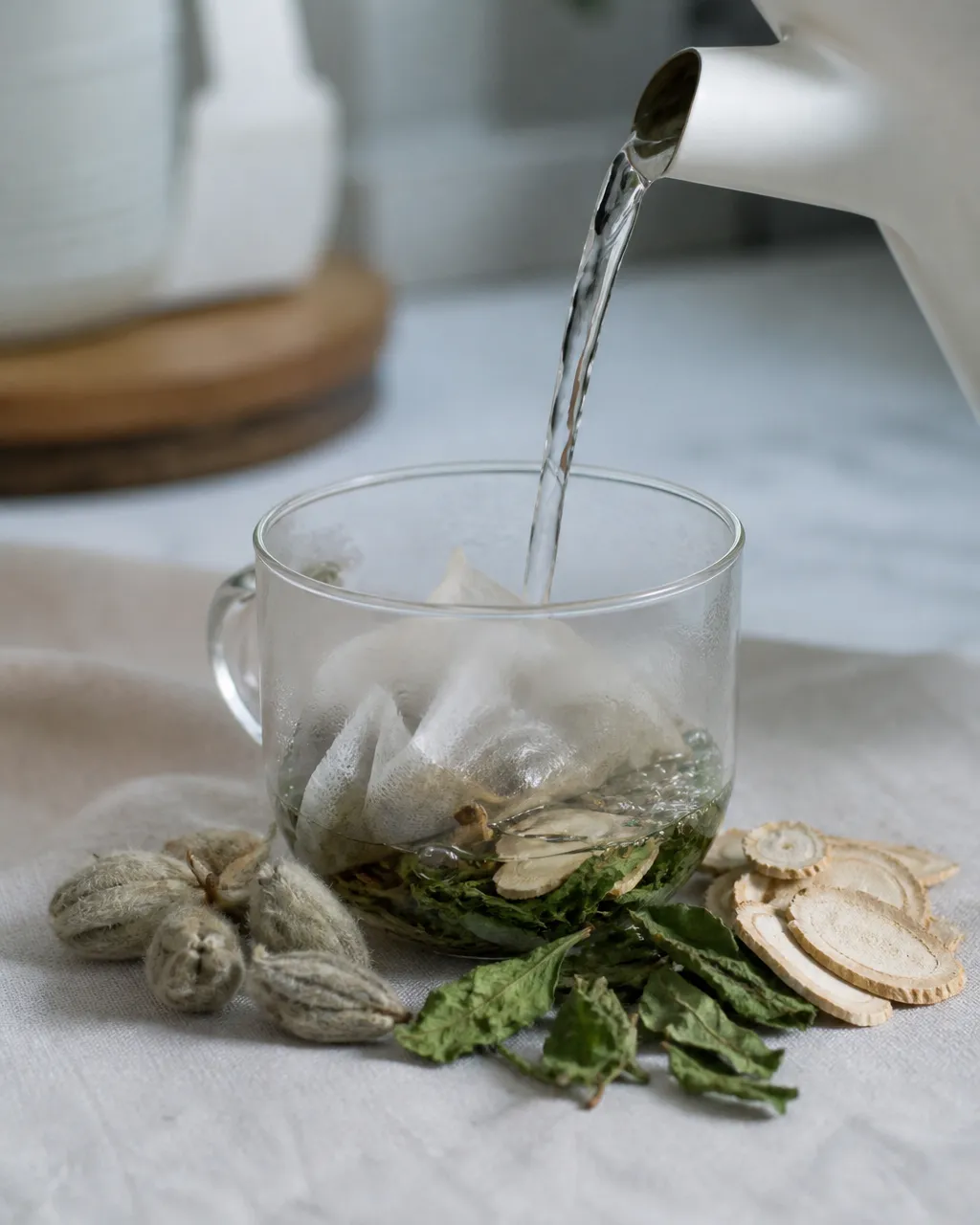 Magnolia flower in a tea bag with mint and Bai Zhi steeping for runny nose tea