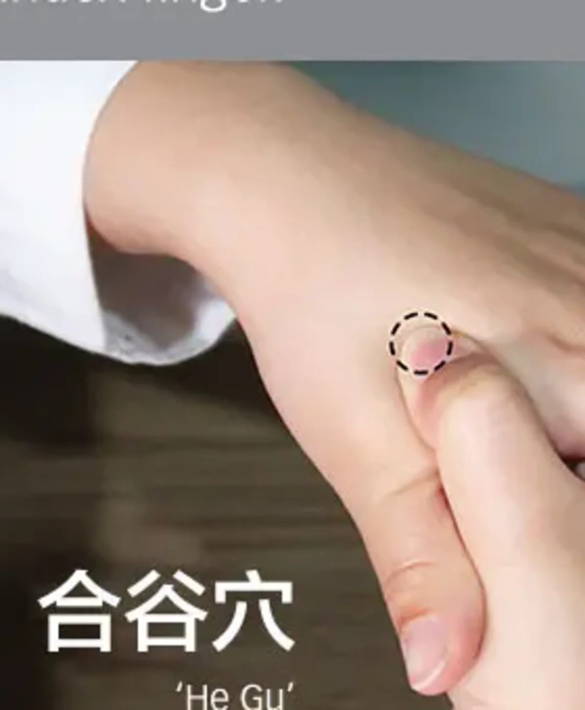 Thumb pressing He Gu LI4 in the fleshy webbing between thumb and index finger