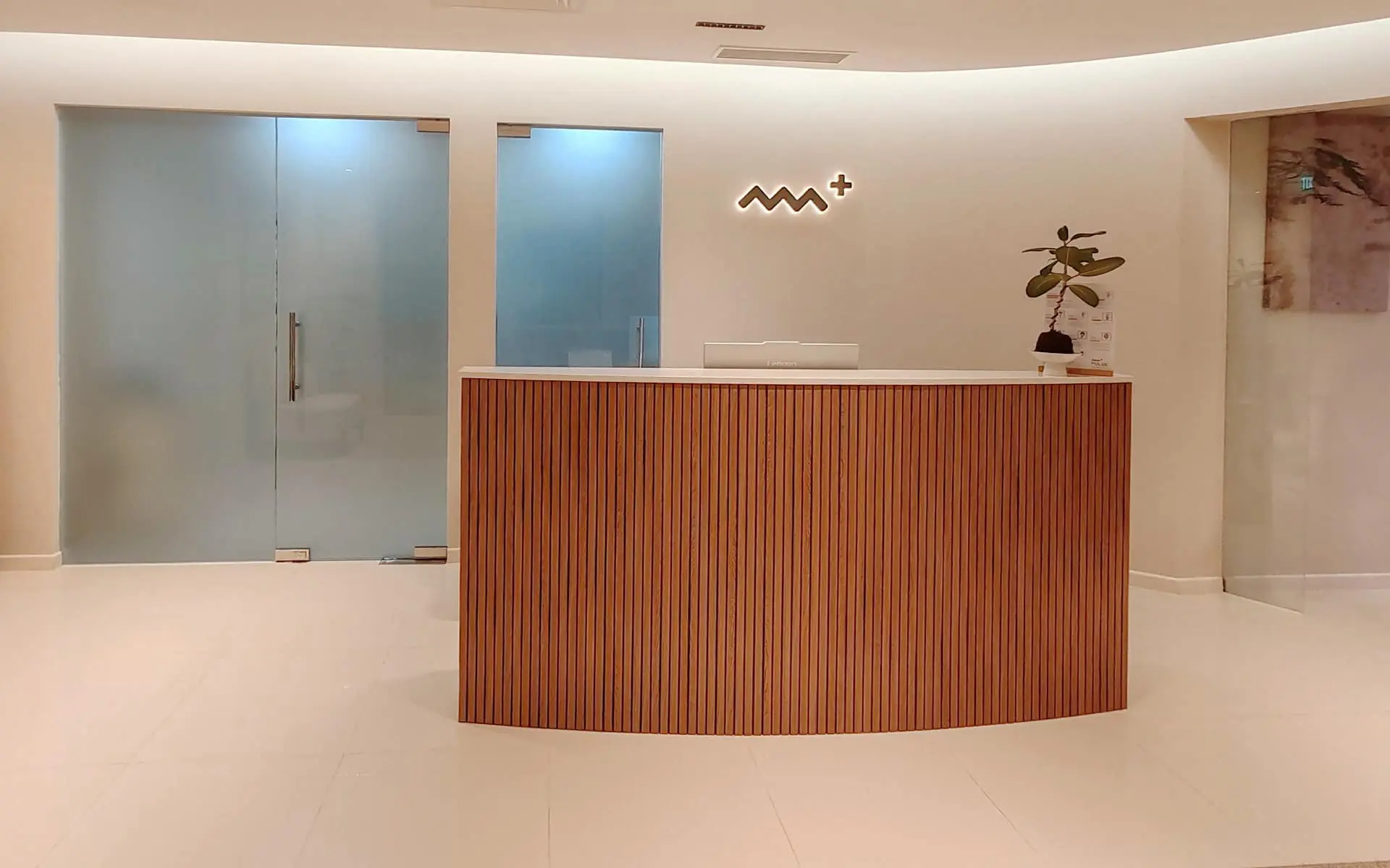 Glass entrance to PULSE Signature TCM clinic at ION Orchard