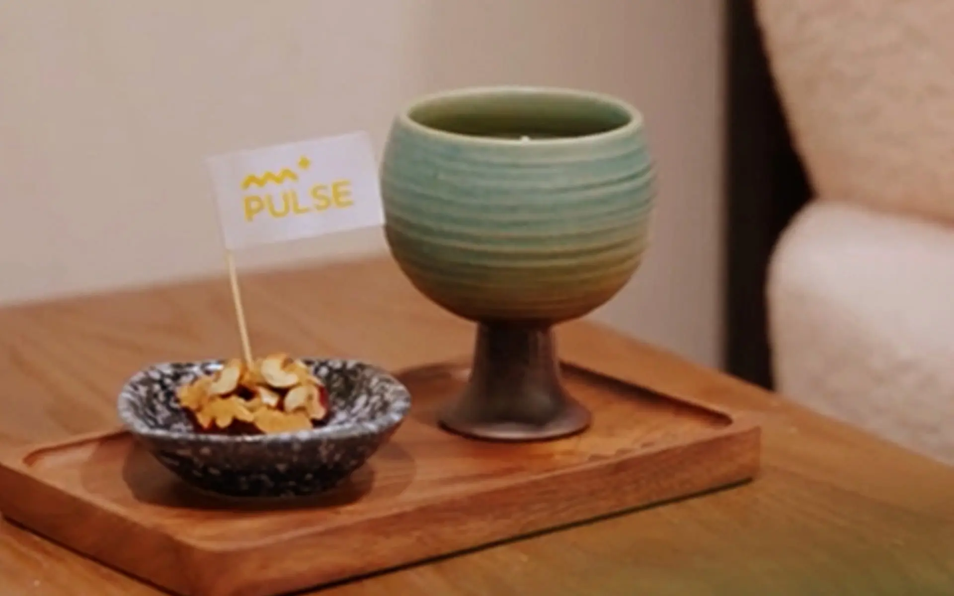 Welcome hospitality tray with stone bowl and ceramic vessel at PULSE Signature