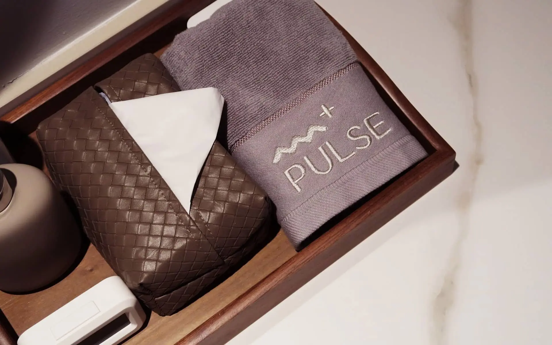 Folded towels and sanctuary amenities at PULSE Signature